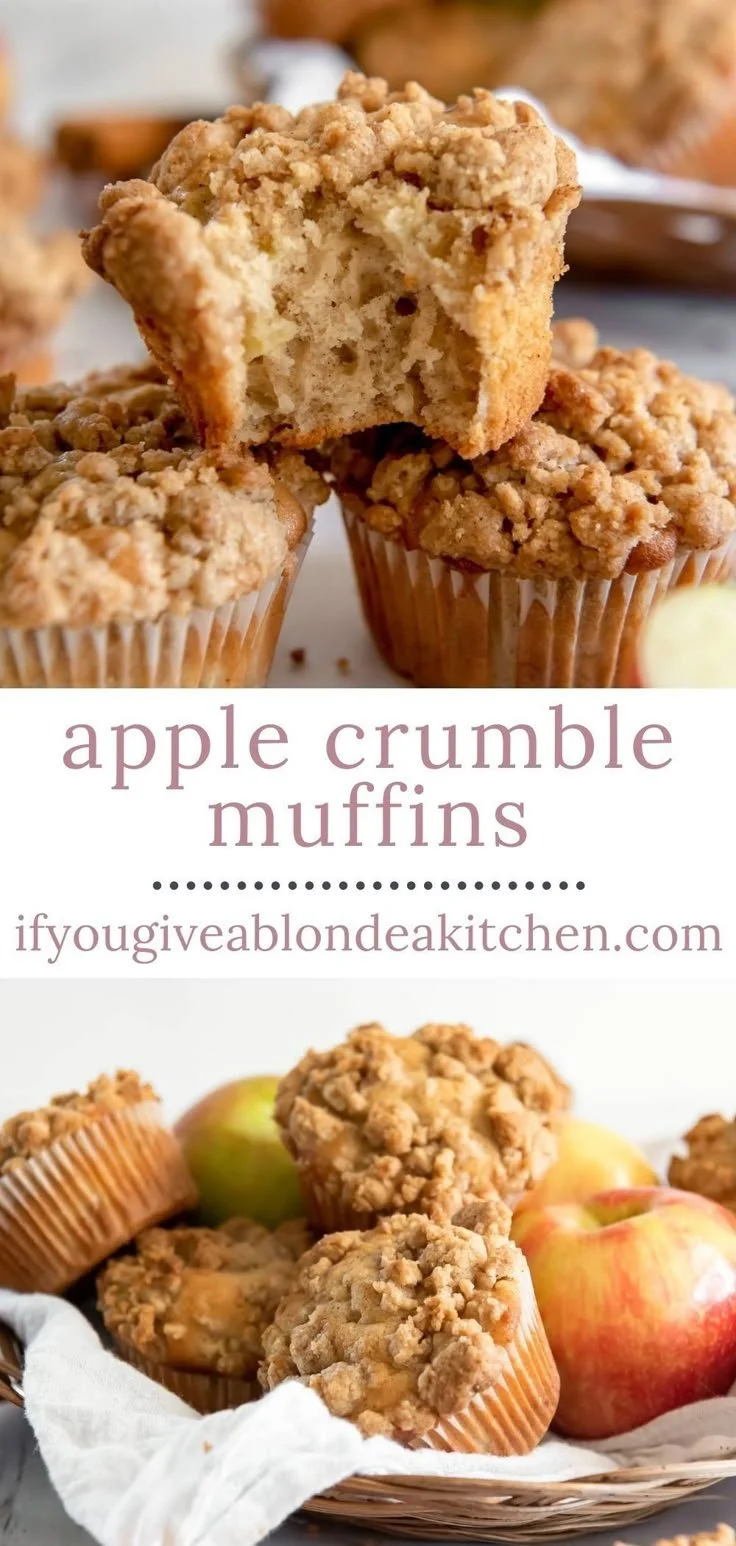 Freshly baked apple muffins with crumb topping on a wooden table