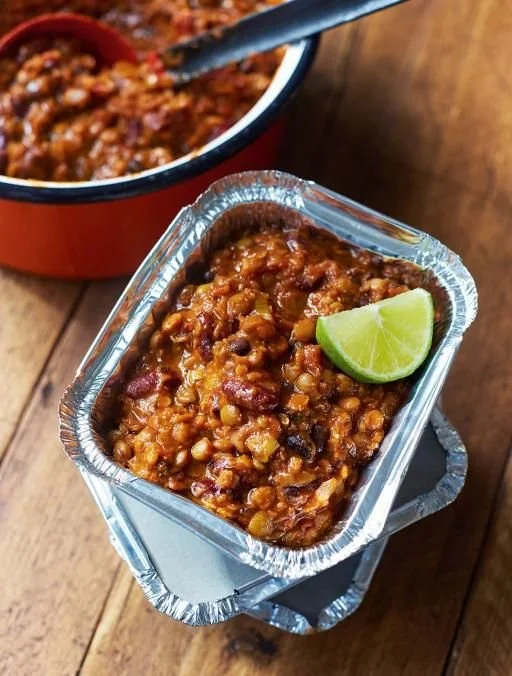 Delicious bowl of Jamie Oliver's Chilli Con Veggie served with toppings.