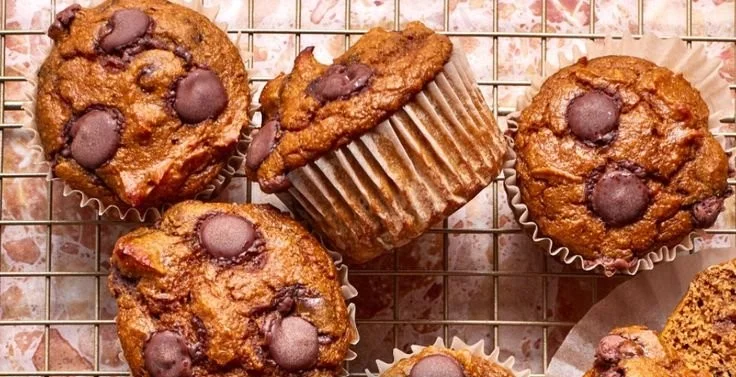 Freshly baked Cottage Cheese Muffins on a wooden table