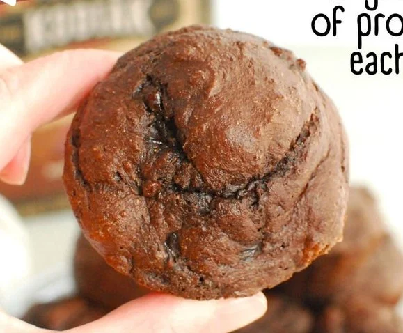Delicious Dark Chocolate Kodiak Protein Muffins displayed on a rustic wooden table