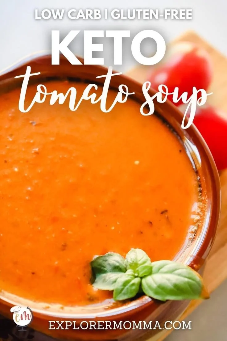 Bowl of easy keto tomato soup topped with herbs and cream