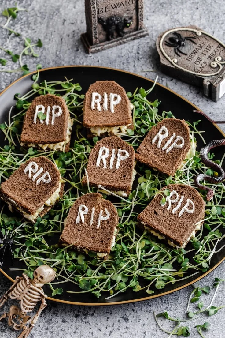 Spooky Halloween sandwiches shaped like tombstones for a festive celebration.