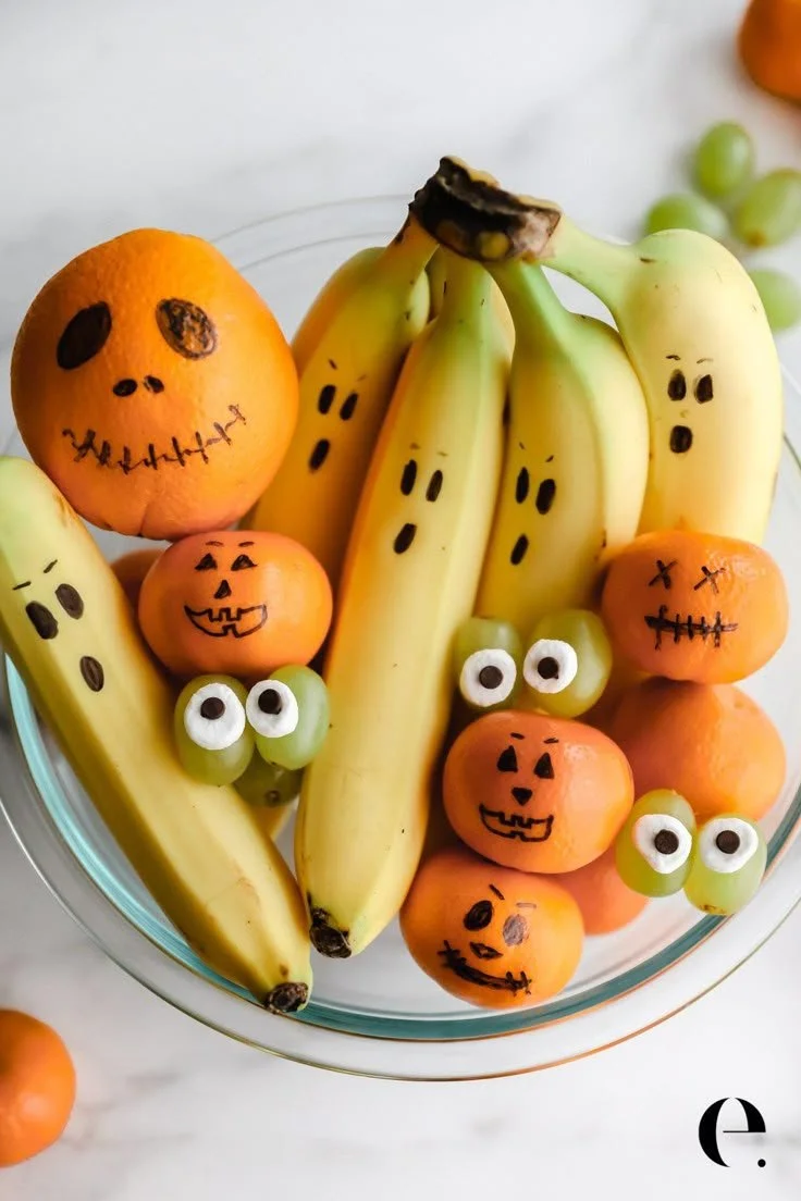 Creative Halloween fruit displays for festive celebrations by Elizabeth Rider.