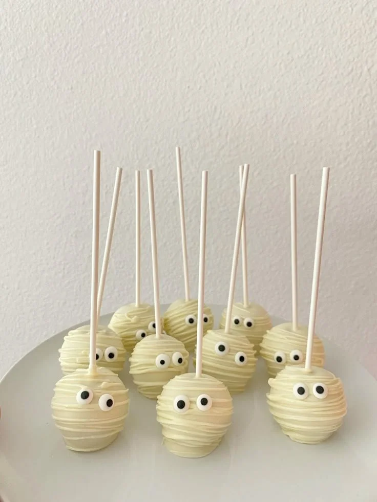 Creepy and cute mummy cake pops decorated for Halloween