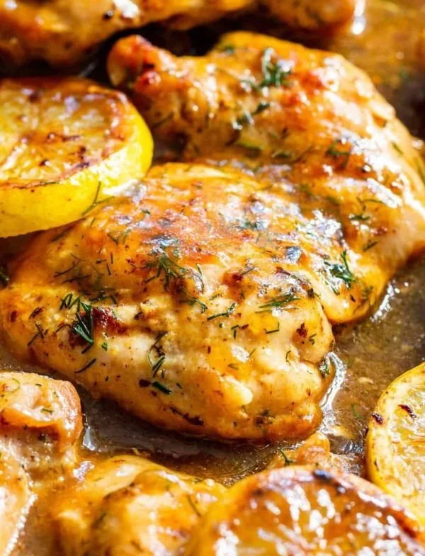 Healthy Paleo Lemon Dill Chicken served with fresh herbs and lemon slices