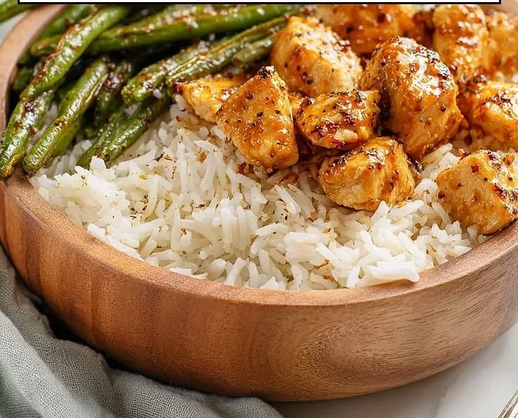 Delicious honey mustard chicken served in a bowl with fresh vegetables