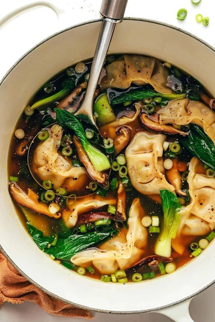 Bowls of delicious homemade Potsticker Soup recipe with fresh ingredients