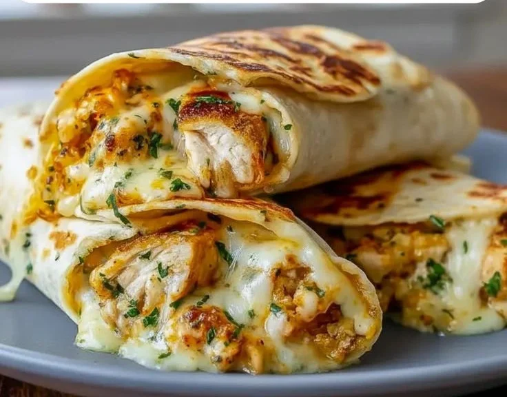 Low carb cheesy garlic chicken wraps served on a plate for meal prep