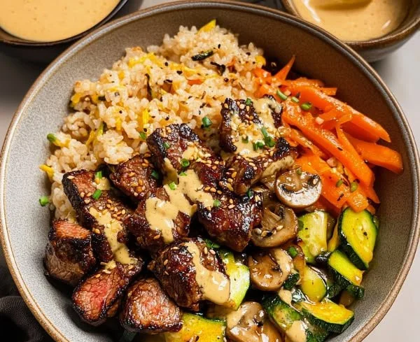 Delicious hibachi steak bowls with grilled vegetables and rice