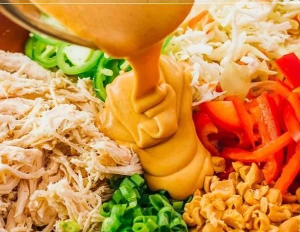 Delicious Thai Chicken Salad with vegetables and herbs on a plate