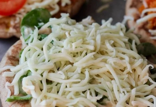 Delicious homemade pita pizzas topped with fresh ingredients