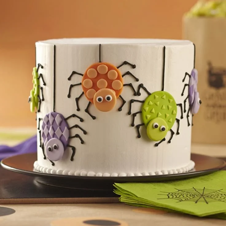 Spooky Halloween cake decorated with ghosts and pumpkins for a festive celebration