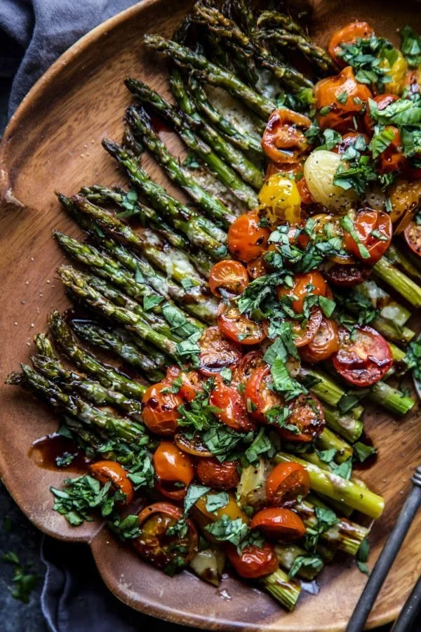 Delicious Caprese roasted asparagus with mozzarella and tomatoes