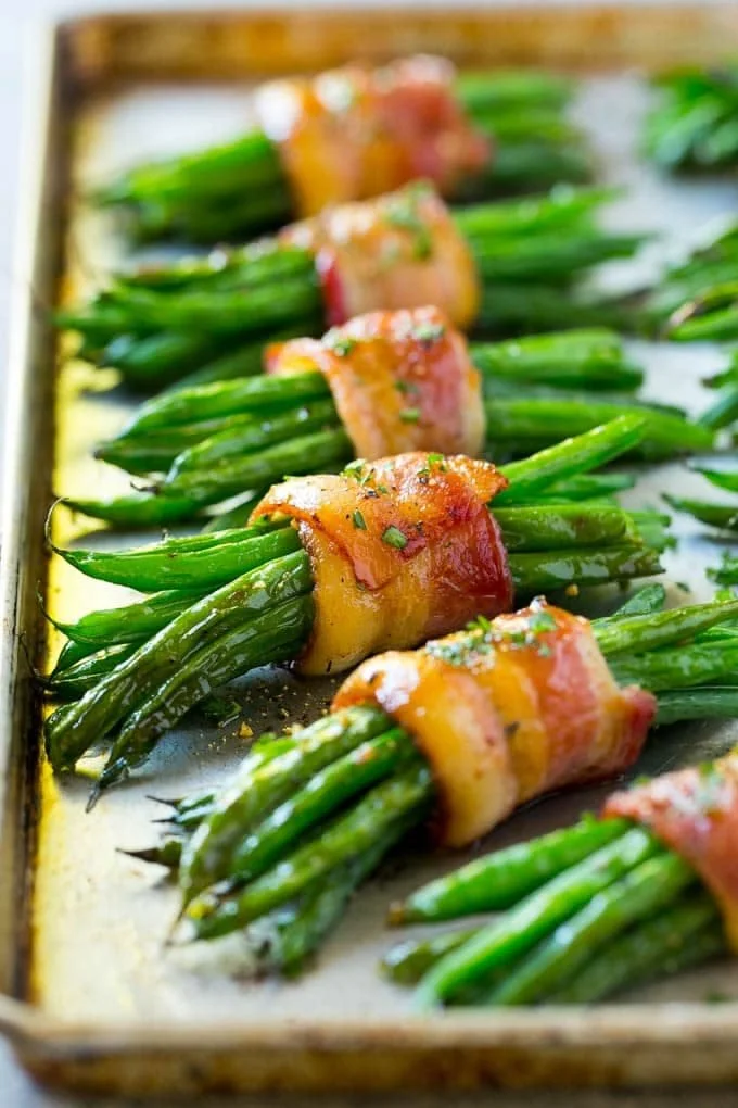 Bacon wrapped asparagus appetizer garnished and ready to serve