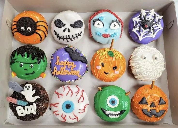 Colorful Halloween donuts decorated with spooky themes for festive celebrations