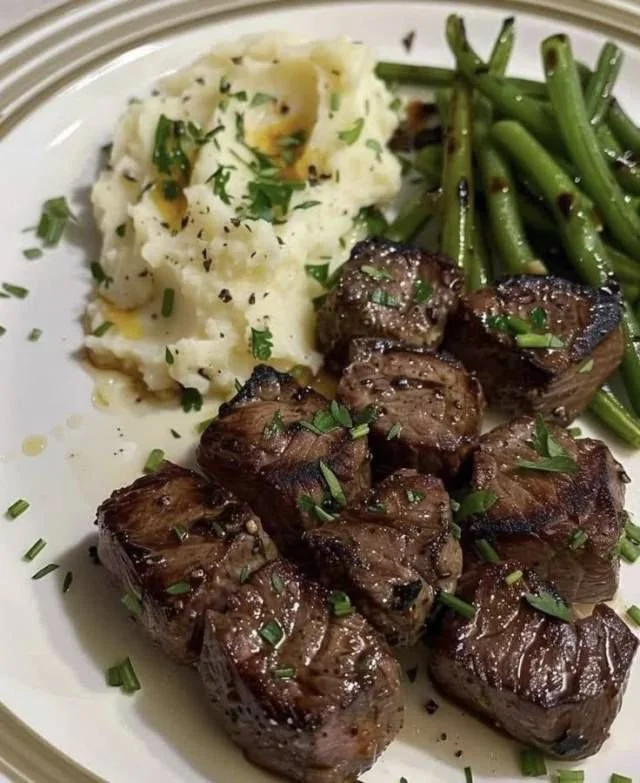 Grilled steak cubes prepared on a barbecue grill for meal prep