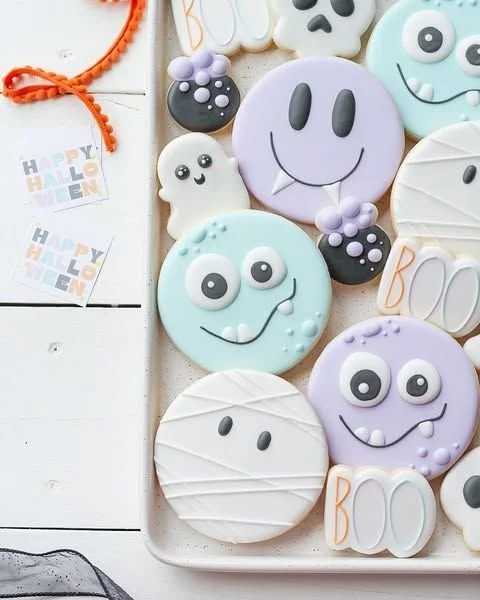 Decorated Halloween baby cookies for a baby's first Halloween celebration.