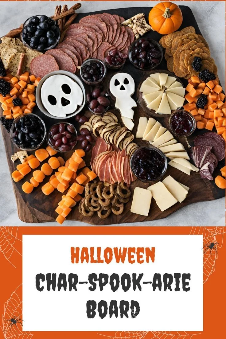 Spooky cheese board for Halloween with themed decorations and delicious cheeses.