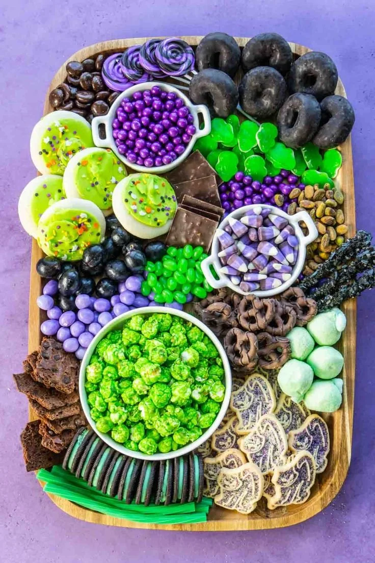 Halloween-themed charcuterie boards with spooky decorations and tasty treats