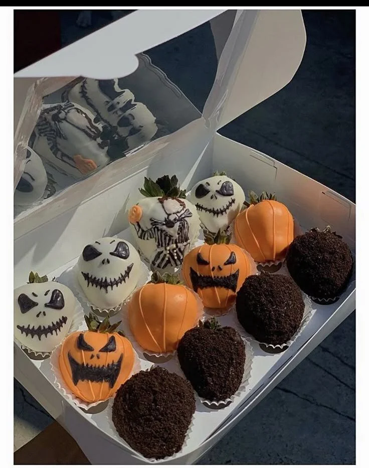 Spooky Halloween cupcakes and chocolate-covered strawberries for treats