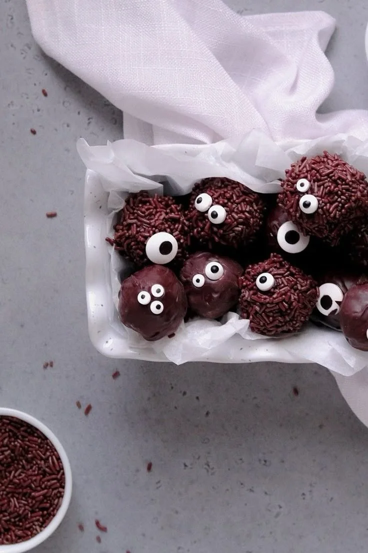 Spooky Halloween monster brownie truffles decorated for Halloween.