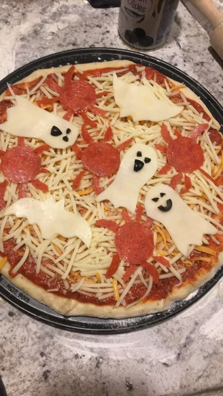 Homemade Halloween pizza with spooky decorations