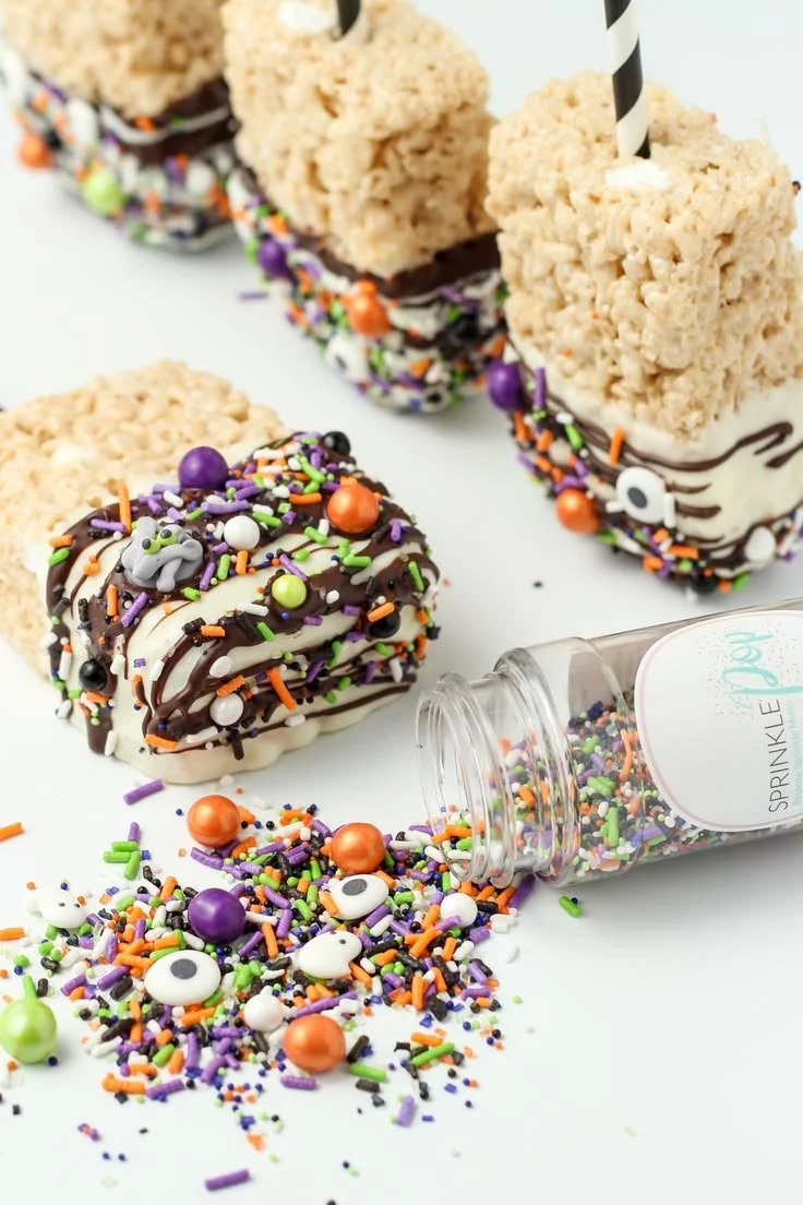 Colorful Halloween Rice Krispie Pops decorated for a festive celebration