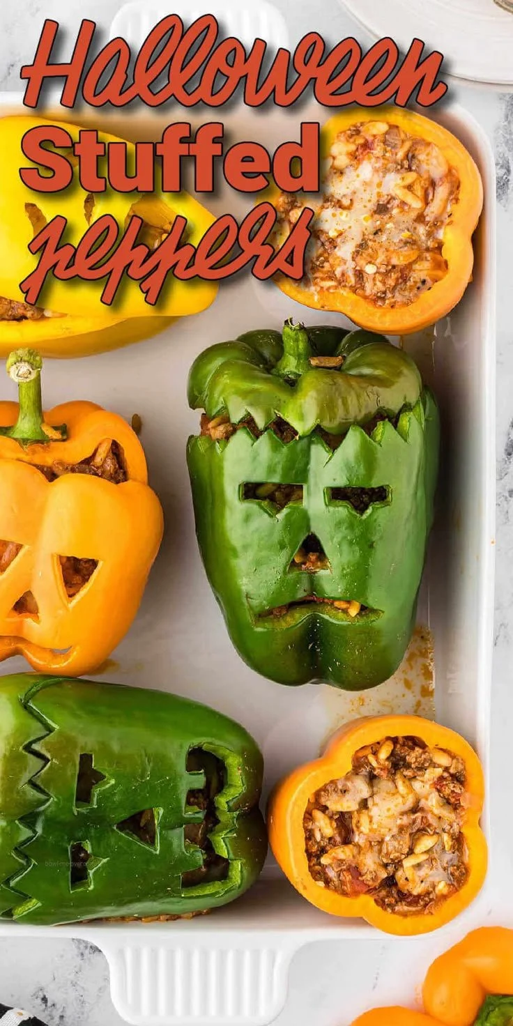 Halloween-themed stuffed peppers filled with colorful ingredients.