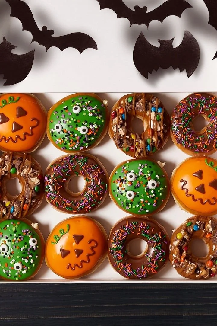 Festive Krispy Kreme Halloween doughnuts with cake batter filling.