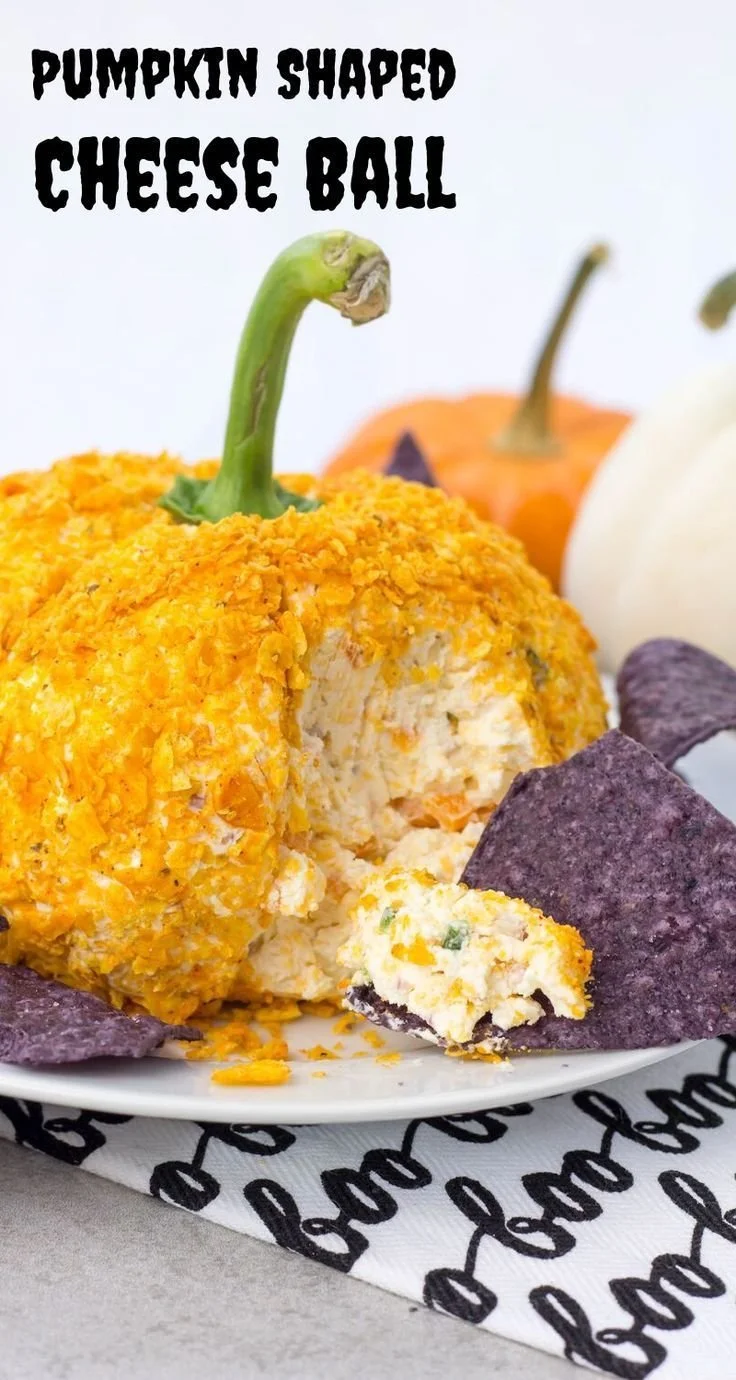 Pumpkin shaped cheese ball ready to serve for Halloween or fall gatherings