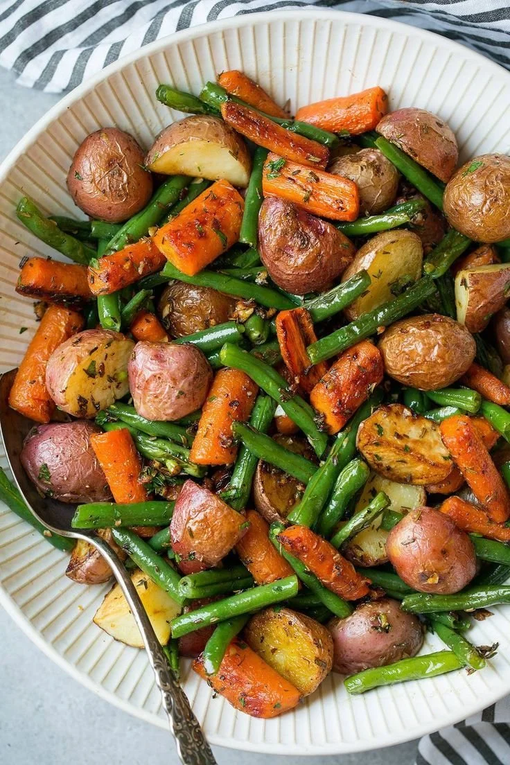Plate of roasted vegetables seasoned with garlic and herbs