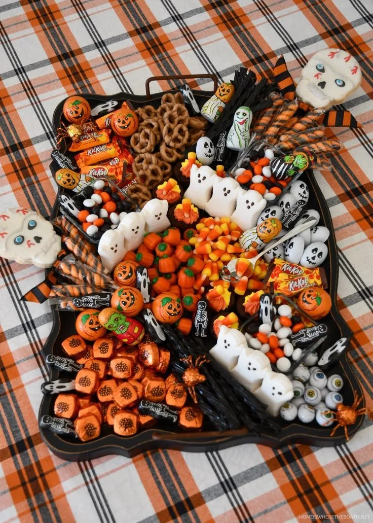 Colorful Halloween candy tablescape set by Rod and Rowena for trick-or-treaters