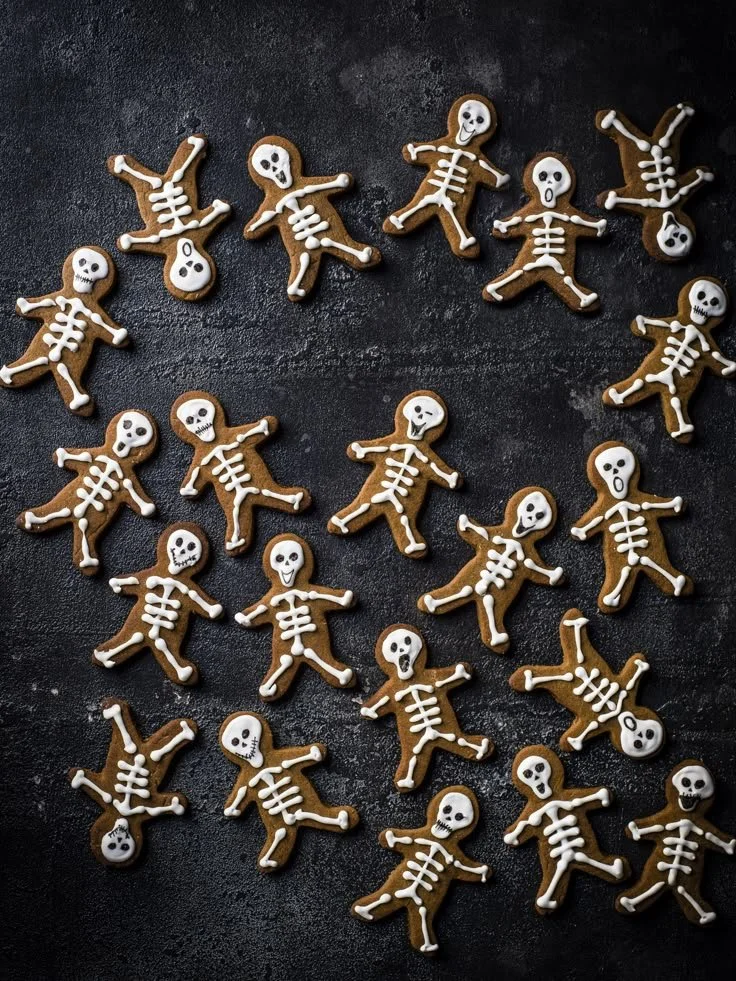 Skeleton gingerbread men displayed on a festive tray