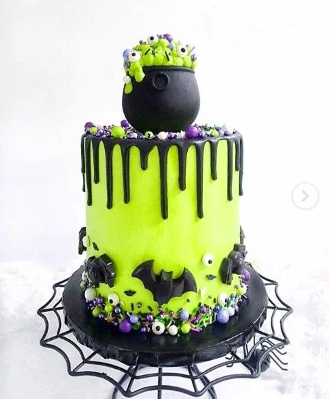 Spooky Halloween cake with green and black frosting themed for witches.