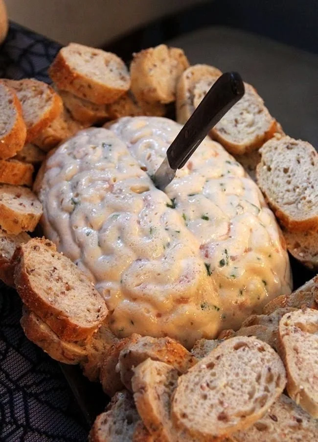 Spooky Halloween dips for adult party appetizers featuring creative Halloween recipes.