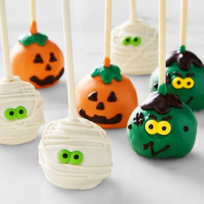 Colorful Halloween treats featured on a dessert table from Williams Sonoma